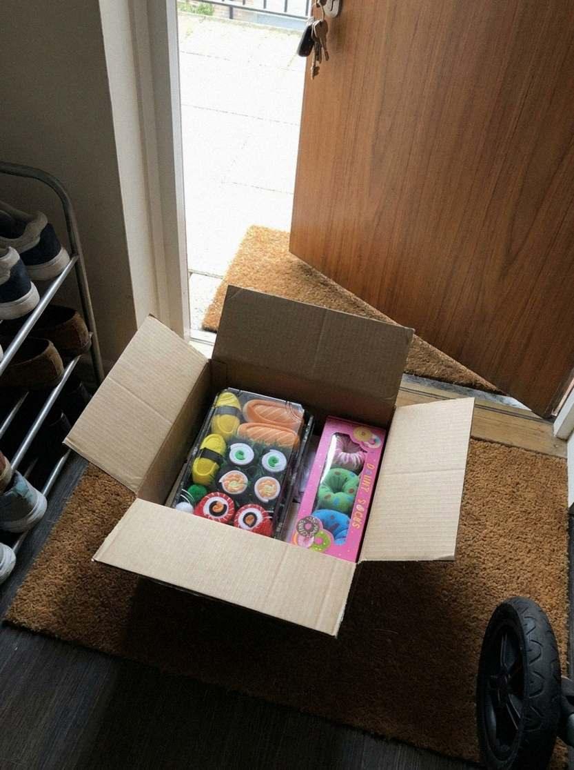 Sushi sock box on a doormat (AI-generated illustration)